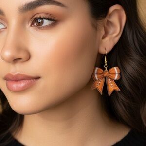 NWT ADORABLE Football Bow Resin Earrings